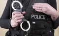 Police officer holding hand cuffs Royalty Free Stock Photo