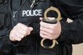 Police officer holding handcuffs Royalty Free Stock Photo