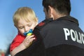 Police Officer Holds Baby