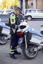 A police officer on a motorcycle.