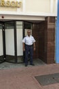 Police officer outside of police station isolated. Profession concept.