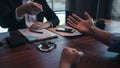 Police officer presenting evidence to suspect after committed a crime, investigation and interrogation concepts Royalty Free Stock Photo