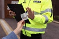 Police officer rejecting bribe outdoors, closeup view Royalty Free Stock Photo