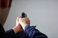 Police officer`s hands aiming with gun. Royalty Free Stock Photo