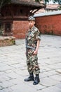 Police officer standing guard in town Bhaktapur near Kathmandu Nepal Royalty Free Stock Photo