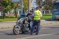 Police officer stops biker for violating traffic rules
