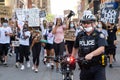 Police Officer walks ahead of Black Lives Matter Protesters in Toronto, Ontario Royalty Free Stock Photo