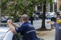 A police officer wearing face mask is talking to a citizen also wearing face mask