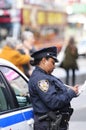 Police officer writing citation