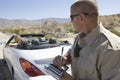 Police Officer Writing Traffic Ticket To Woman In Car Royalty Free Stock Photo