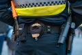 A police officer's belt with handcuffs, pepper spray, walkie talkie and a gun Royalty Free Stock Photo