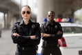 police officers with crossed arms looking at camera in front Royalty Free Stock Photo