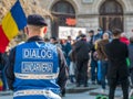 Police officers and Gendarmerie or military police closely supervising the demonstrators from