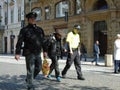 Police officers hold homeless cowboy