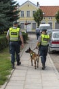 Police officers patrol with German Shepherd dog Klaipeda