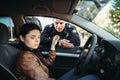 Police officers in uniform check female driver Royalty Free Stock Photo