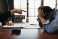 Police officers warned offenders at the office while the accused was stressed Royalty Free Stock Photo