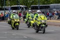 Police outriders on motorbikes or motorcycles escorting a motorcade Royalty Free Stock Photo
