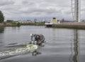 A Police Patrol Boat in front of the Glasgow Tower at Pacific Quay in Glasgow, Scotland.