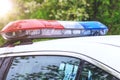 Police patrol car with sirens off during a traffic control. Blue