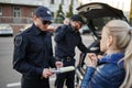 Police patrol stop woman and checking car Royalty Free Stock Photo