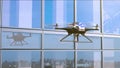 Police Quadcopter Patrols along the Office Building