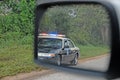 Police in rear view mirror Royalty Free Stock Photo