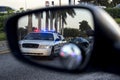 Police on rear view mirror Royalty Free Stock Photo