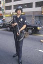 Police in riot gear holding weapon, downtown Los Angeles, California