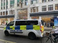 Police rushing to an incident on the streets of London, England