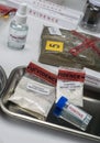 Police scientist examines seizures of adulterated fentanyl in crime lab