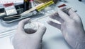 Police scientist making drug test in crime lab Royalty Free Stock Photo