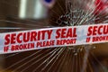 Police Security Seal tape across broken glass window Royalty Free Stock Photo