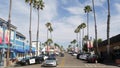 Police sheriff car. Palm trees on street, pacific coast tropical resort. Oceanside, California USA