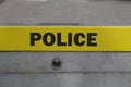 Police sign on cordon block reinforcement made of concrete.