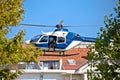 Police sniper in helicopter urban area low flight view