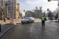 Police stand guard at a roadblock, police car bloc