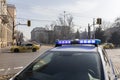 Police stand guard at a roadblock, police car bloc