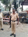 Police standing with holding gun