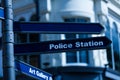 Police station street sign hanging on the lamppost. Arrow sign with police station direction. Royalty Free Stock Photo