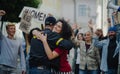 Police stopping group of people activists protesting on streets, women march and demonstration concept.