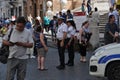 Police on the street of Rome answer a tourist`s question.