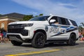 A police SUV vehicle driving through the fourth of July parade