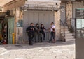 Police talk with a passerby at the entrance to the Arabian market in the Jaffa Gate area in the old city of Jerusalem, Israel