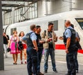 Police talk to several migrants that arrived by train