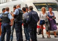 Police talk to several migrants that arrived by train