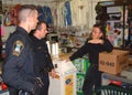 Police talk to a storekeeper