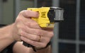 Police Taser gun on aim Royalty Free Stock Photo