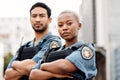 Police, team and arms crossed in confidence for city protection, law enforcement or crime. Portrait of confident man and