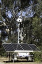 Police trailer with unfolded solar panels and surveillance cameras on top